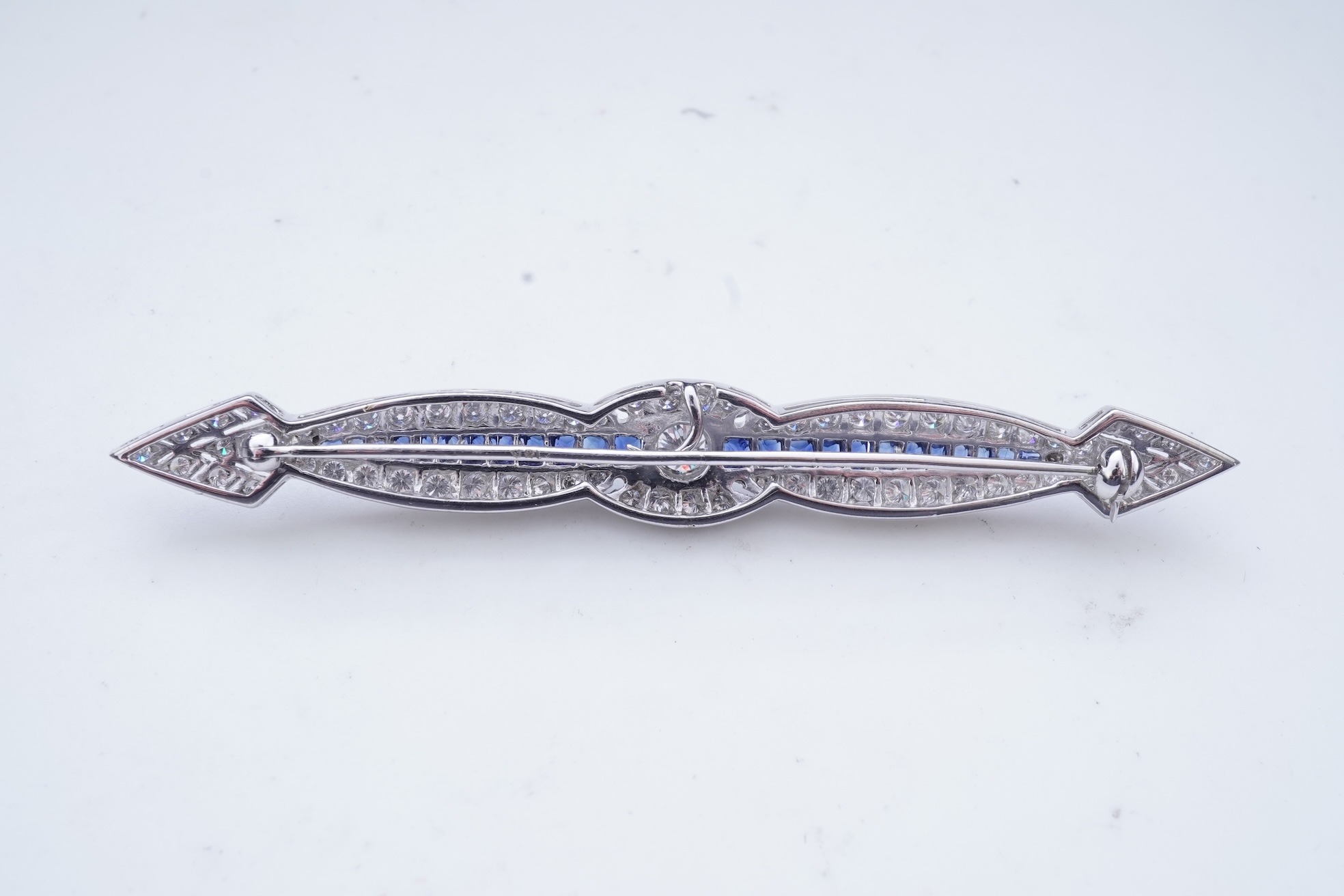 A sapphire and diamond bar brooch